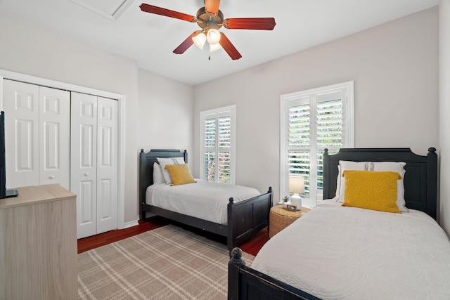 bedroom featuring wood finished floors, a closet, and ceiling fan