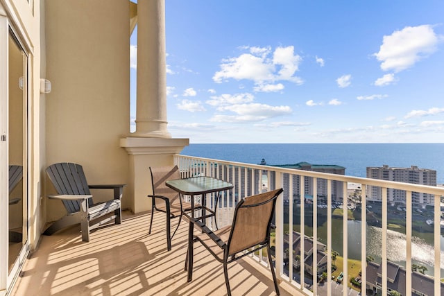 balcony featuring a water view
