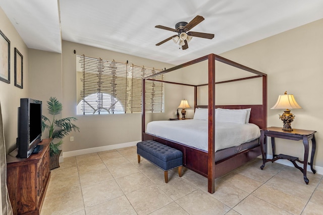 bedroom featuring baseboards, a ceiling fan, and light tile patterned floors
