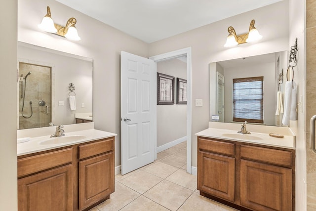 bathroom with a sink, two vanities, a stall shower, and tile patterned floors