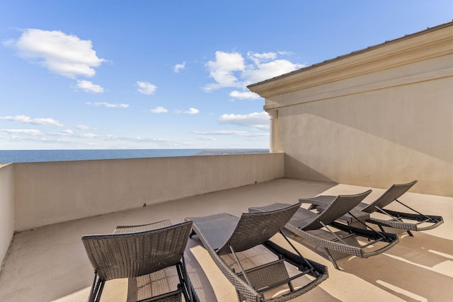 view of patio featuring a balcony