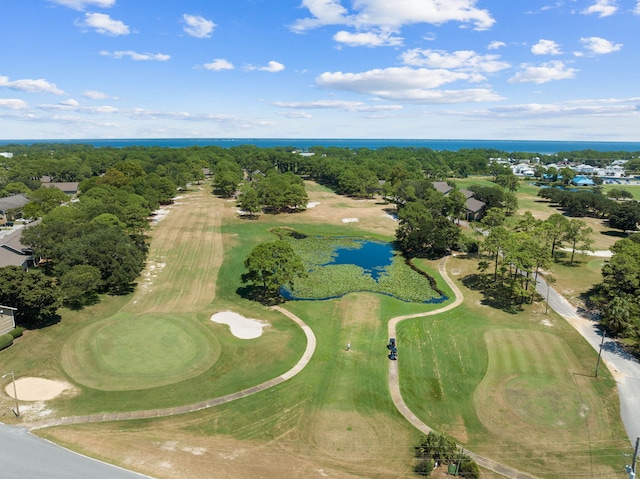 birds eye view of property with a water view and golf course view