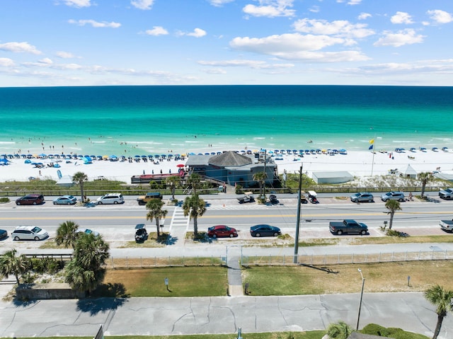 bird's eye view with a water view and a beach view