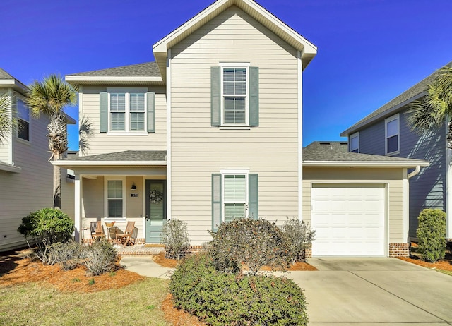175 Christian Dr, Santa Rosa Beach, FL 32459 - traditional home with a garage, covered porch, driveway, and roof with shingles