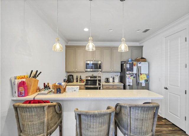 175 Christian Dr, Santa Rosa Beach, FL 32459 - kitchen with appliances with stainless steel finishes, a breakfast bar, light countertops, backsplash, and visible vents