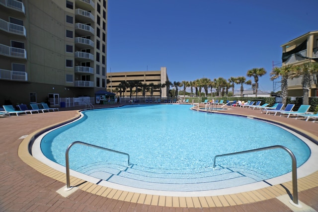 16819 Front Beach Rd Unit 1114, Panama City Beach, FL 32413 - community pool with a patio