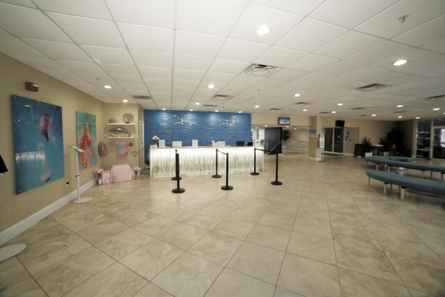 16819 Front Beach Rd Unit 1114, Panama City Beach, FL 32413 - workout area featuring a drop ceiling, baseboards, light tile patterned flooring, and recessed lighting