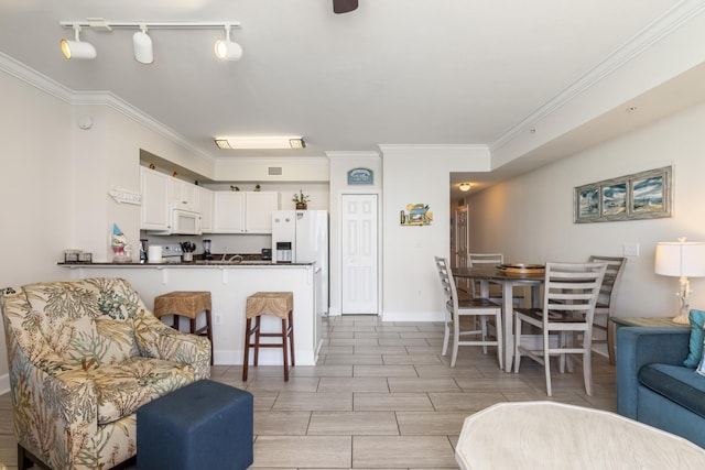 16819 Front Beach Rd Unit 1114, Panama City Beach, FL 32413 - living area featuring crown molding and baseboards