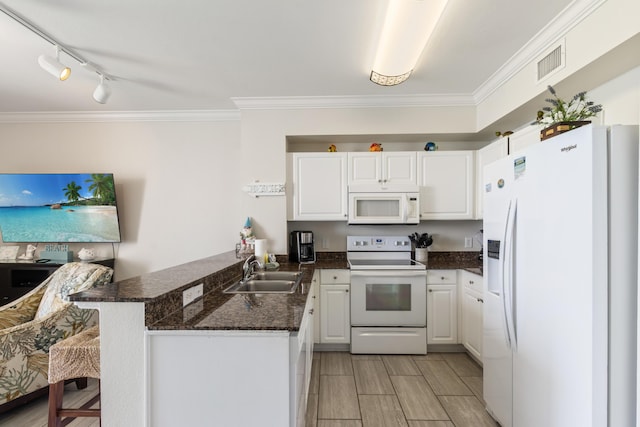 16819 Front Beach Rd Unit 1114, Panama City Beach, FL 32413 - kitchen with white appliances, a sink, a peninsula, white cabinetry, and crown molding