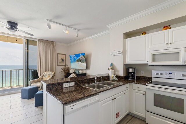 16819 Front Beach Rd Unit 1114, Panama City Beach, FL 32413 - kitchen featuring white appliances, a sink, a peninsula, ceiling fan, and white cabinets