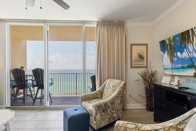 16819 Front Beach Rd Unit 1114, Panama City Beach, FL 32413 - living area featuring healthy amount of natural light, crown molding, ceiling fan, a wall of windows, and baseboards