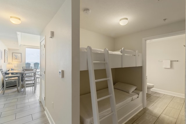 16819 Front Beach Rd Unit 1114, Panama City Beach, FL 32413 - unfurnished bedroom with baseboards and ensuite bathroom