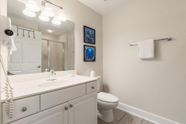 16819 Front Beach Rd Unit 1114, Panama City Beach, FL 32413 - full bath with a shower stall, baseboards, toilet, vanity, and wood finished floors