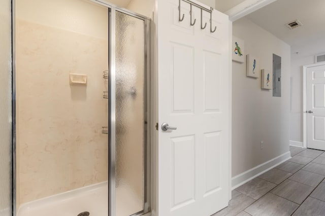 16819 Front Beach Rd Unit 1114, Panama City Beach, FL 32413 - full bath with electric panel, a stall shower, and baseboards