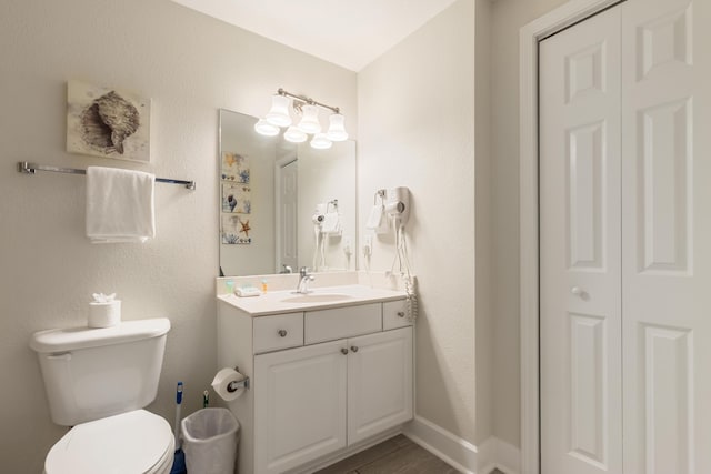 16819 Front Beach Rd Unit 1114, Panama City Beach, FL 32413 - bathroom featuring toilet, vanity, a closet, and a textured wall