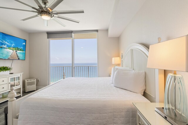 16819 Front Beach Rd Unit 2415, Panama City Beach, FL 32413 - bedroom with access to exterior, a water view, expansive windows, and a ceiling fan