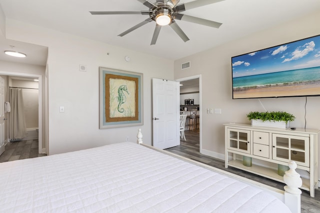 16819 Front Beach Rd Unit 2415, Panama City Beach, FL 32413 - bedroom with wood finished floors, baseboards, and a ceiling fan