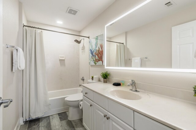 16819 Front Beach Rd Unit 2415, Panama City Beach, FL 32413 - bathroom featuring wood finished floors, toilet, vanity, shower / bath combination with curtain, and recessed lighting