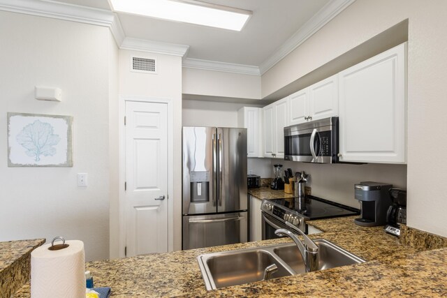 16819 Front Beach Rd Unit 2415, Panama City Beach, FL 32413 - kitchen featuring appliances with stainless steel finishes, crown molding, a sink, and white cabinetry