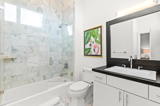 bathroom featuring vanity, toilet, and bathtub / shower combination