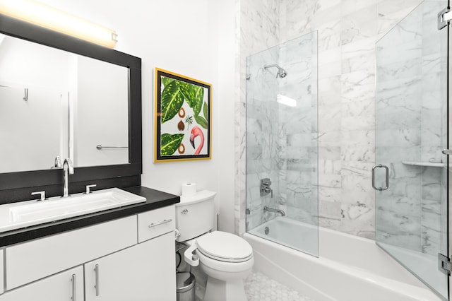 full bathroom with toilet, vanity, and combined bath / shower with glass door