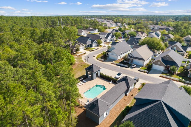 180 Blakely Drew Blvd, Santa Rosa Beach, FL 32459 - aerial perspective of suburban area featuring a pool and a heavily wooded area