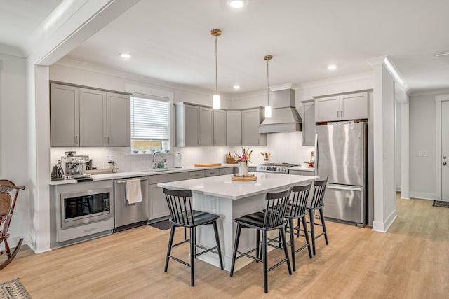 2108 Royal Tern St, Panama City, FL 32405 - kitchen with a sink, appliances with stainless steel finishes, gray cabinetry, and a kitchen breakfast bar