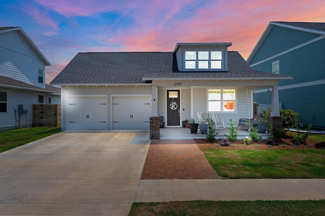 2108 Royal Tern St, Panama City, FL 32405 - view of front of property featuring a porch, concrete driveway, a shingled roof, and a garage