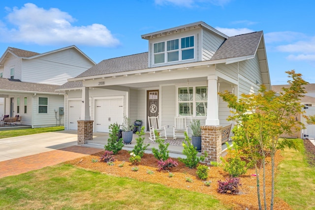 2108 Royal Tern St, Panama City, FL 32405 - view of front of property with an attached garage, a shingled roof, covered porch, and driveway