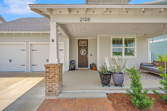 2108 Royal Tern St, Panama City, FL 32405 - entrance to property with covered porch, an attached garage, concrete driveway, and a shingled roof