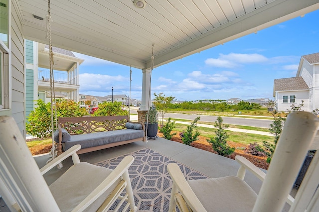 2108 Royal Tern St, Panama City, FL 32405 - view of patio with a porch and a residential view