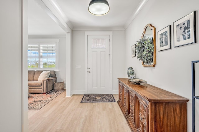 2108 Royal Tern St, Panama City, FL 32405 - entrance foyer featuring crown molding, baseboards, and light wood finished floors