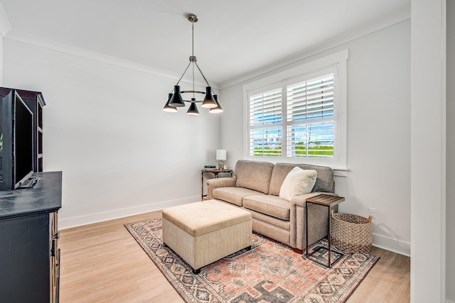 2108 Royal Tern St, Panama City, FL 32405 - living area with light wood-type flooring, ornamental molding, baseboards, and a chandelier