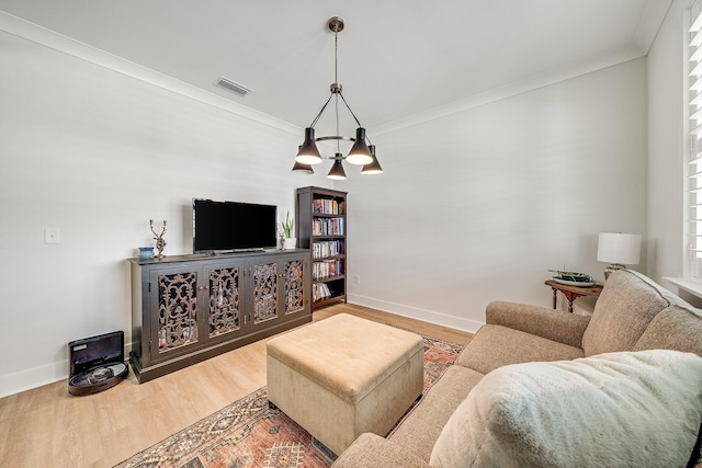2108 Royal Tern St, Panama City, FL 32405 - living area featuring an inviting chandelier, crown molding, wood finished floors, and visible vents