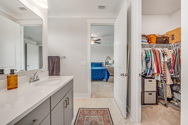 2108 Royal Tern St, Panama City, FL 32405 - bathroom with visible vents, marble finish floor, a walk in closet, and vanity