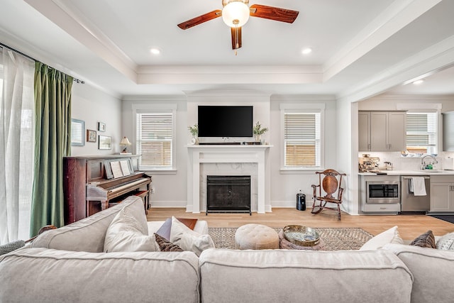 2108 Royal Tern St, Panama City, FL 32405 - living room featuring ceiling fan, a tray ceiling, and a wealth of natural light