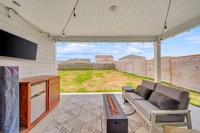 2108 Royal Tern St, Panama City, FL 32405 - view of patio with a fenced backyard and an outdoor living space with a fire pit