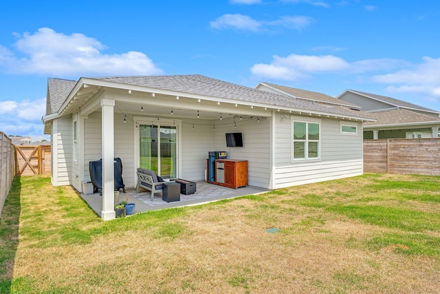 2108 Royal Tern St, Panama City, FL 32405 - rear view of property with a yard, a patio, a fenced backyard, and roof with shingles