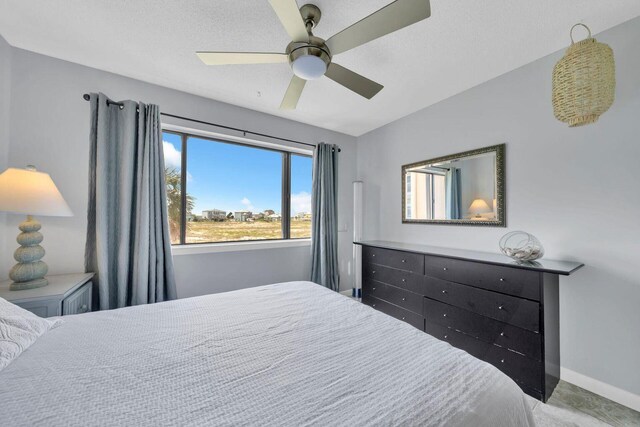 7453 Sunset Harbor Dr Apt 2-204, Navarre, FL 32566 - bedroom featuring ceiling fan and baseboards