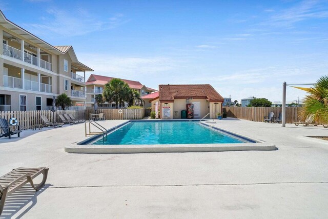 7453 Sunset Harbor Dr Apt 2-204, Navarre, FL 32566 - pool featuring a patio area and fence