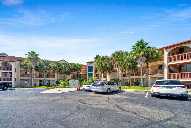 7453 Sunset Harbor Dr Apt 2-204, Navarre, FL 32566 - view of property with uncovered parking