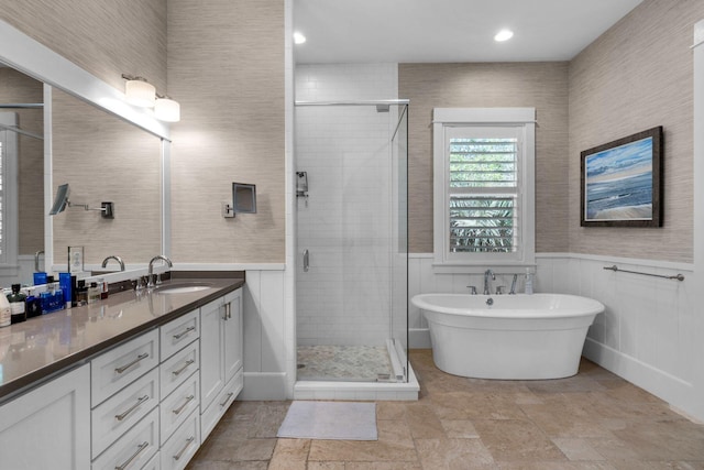 94 Walton Buena Vista Dr, Inlet Beach, FL 32461 - full bathroom with a stall shower, vanity, stone tile floors, wainscoting, and recessed lighting
