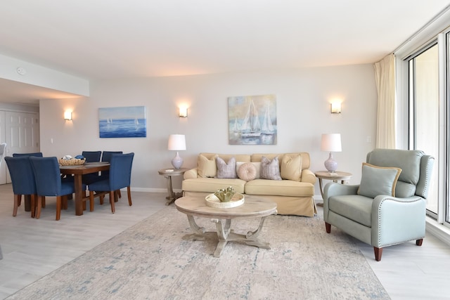 15300 Emerald Coast Pkwy Unit 503, Destin, FL 32541 - living area featuring baseboards and light wood finished floors