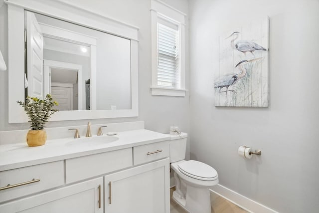 128 Wharf Ln Unit A, Inlet Beach, FL 32461 - bathroom featuring toilet, baseboards, vanity, and wood finished floors