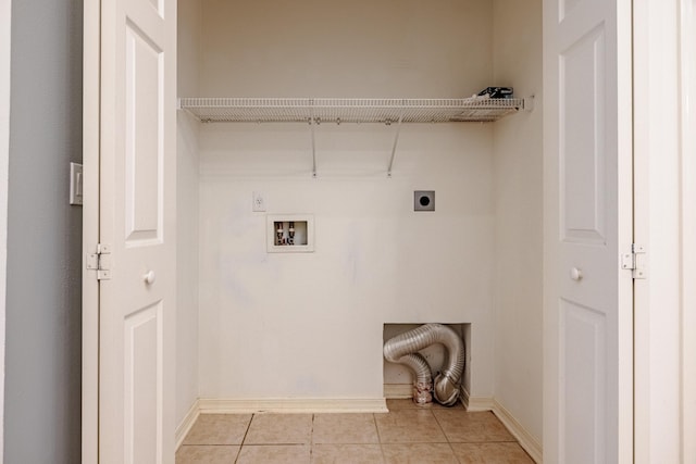 washroom featuring laundry area, hookup for an electric dryer, light tile patterned flooring, baseboards, and hookup for a washing machine
