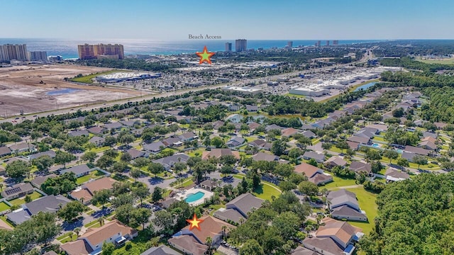 bird's eye view featuring a water view and a city view