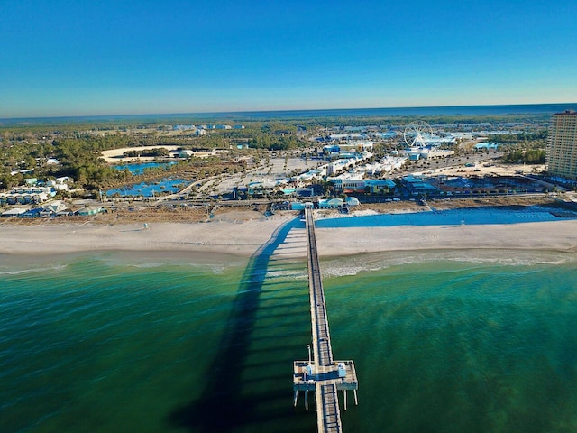 drone / aerial view with a beach view and a water view