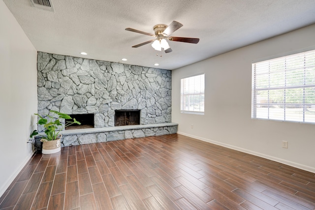 unfurnished living room featuring ceiling fan, baseboards, and wood finished floors