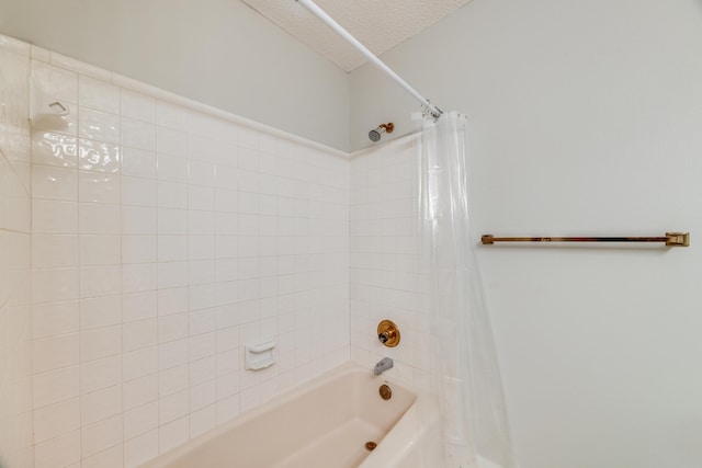 2812 Arnold Palmer Ct, Shalimar, FL 32579 - bathroom featuring shower / bath combo and a textured ceiling
