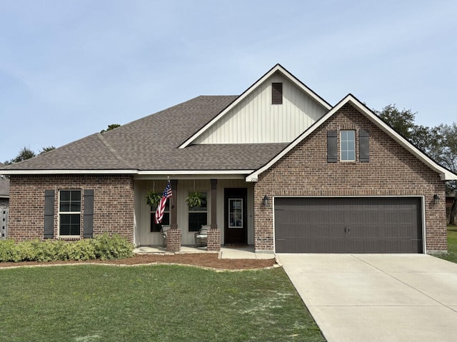 craftsman-style home with covered porch, concrete driveway, a shingled roof, and a front lawn